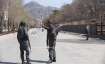 Police patrol the streets after a suicide attack in front