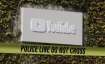 Police tape is shown outside of a YouTube office building