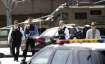 Armed law enforcement personnel exit YouTube headquarters,