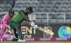 Pakistan's batsman Fakhar Zaman, right, plays a shot as