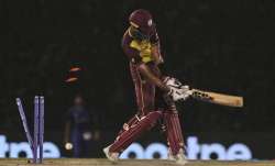 West Indies' Roston Chase is bowled out by Afghanistan's Hamid Hassan on a no-ball during the Cricke