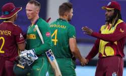 West Indies' Shimron Hetmyer, left, congratulates South Africa's Rassie van der Dussen as West Indie