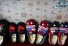 Chinese made children shoes carrying a Chinese map and U.S.