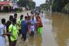   An elderly woman is evacuated towards safer area in