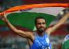 Manjit Singh celebrates after winning the gold medal