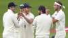 England's Stuart Broad, right, and teammates celebrate the