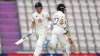 Joe Denly and Rory Burns of England run between the wickets