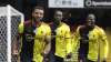 Watford's Troy Deeney, left, celebrates with teammates