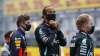 Mercedes driver Lewis Hamilton of Britain, center, stands