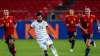 Germany's Ilkay Gundogan, center, runs with the ball past