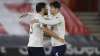 Manchester City's Ruben Dias, left, hugs teammate John