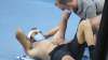 Italy's Matteo Berrettini, left, receives medical treatment