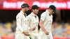 Tim Paine, Nathan Lyon and Pat Cummins of Australia are