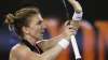 Romania's Simona Halep celebrates after defeating