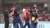 Hardik Pandya of India embraces Virat Kohli as they leave