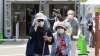 Elderly people go out of the newly-opened mass vaccination
