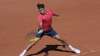 Switzerland's Roger Federer plays a return to Uzbekistan's