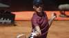 Jannik Sinner of Italy returns the ball to Ugo Humbert of