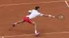 Serbia's Novak Djokovic plays a return to Italy's Lorenzo