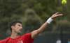 Serbia'a Novak Djokovic serves, during his practice match,