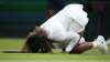 Serena Williams of the US falls to the ground during the