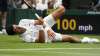Serbia's Novak Djokovic slips on the grass during the men's