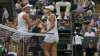 Australia's Ashleigh Barty, right, holds hands with Czech