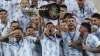 Argentina's Lionel Messi hoists the trophy after beating