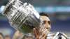 Argentina's Angel Di Maria holds the trophy as he