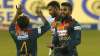 Sri Lanka's Wanindu Hasaranga, right, celebrates taking the