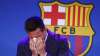 Lionel Messi cries at the start of a press conference at