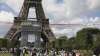 The French Aerial Patrol fly by the Eiffel Tower in Paris,