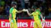 Australia's Mitchell Marsh, left, fist bumps David Warner during the Cricket Twenty20 World Cup fina