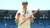 Scott Boland of Australia poses with the Johnny Muller medal, match ball and stump after winning.
