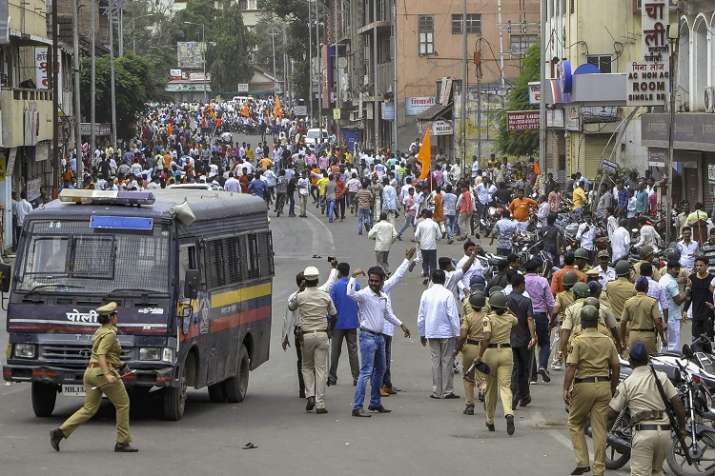 Police personnel clash with the Maratha Kranti Morcha