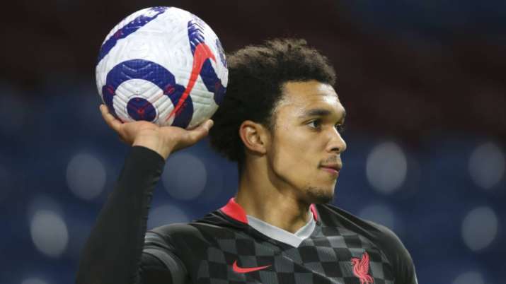 Liverpool's Trent Alexander-Arnold holds up the ball during