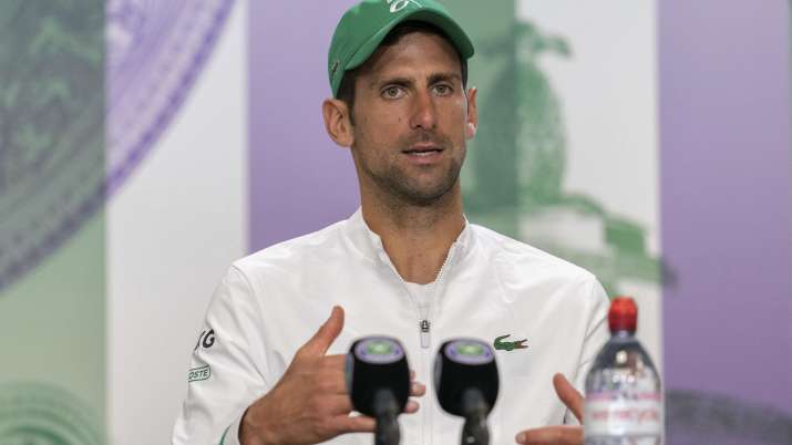 Novak Djokovic attends a press conference after winning the